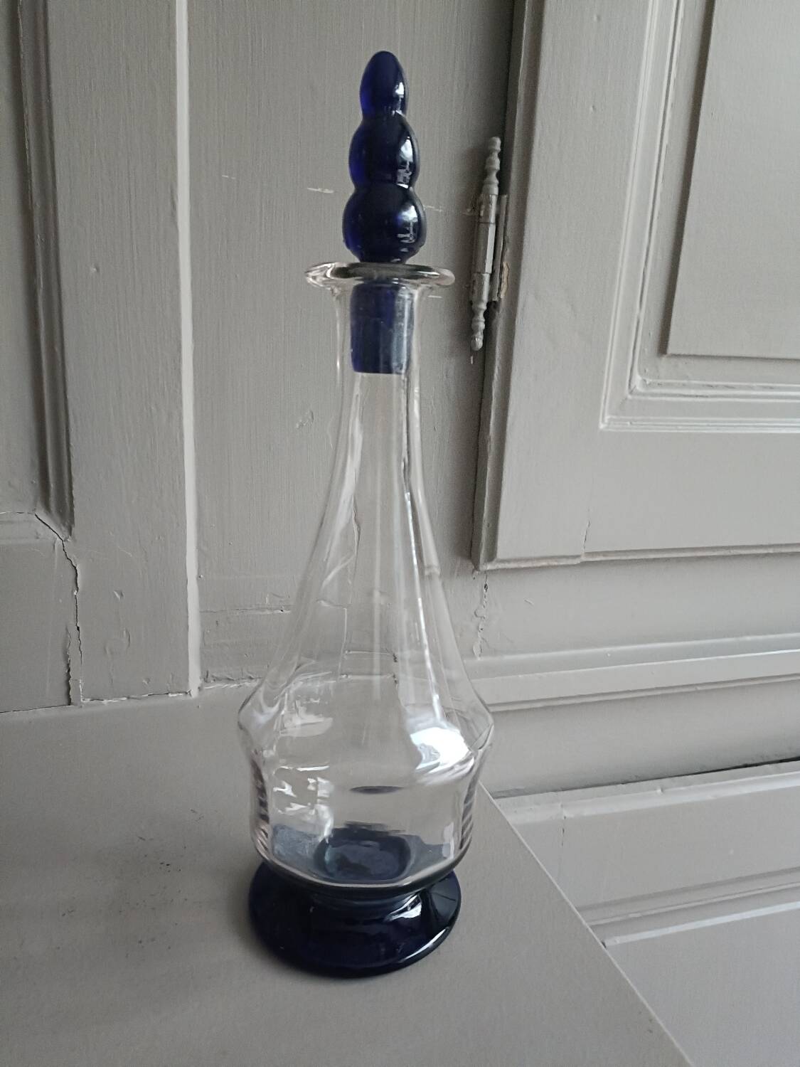 White and blue blown glass carafe