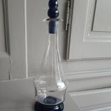 White and blue blown glass carafe