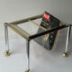 Magazine rack in Plexiglas and gold and chrome metal, 1970