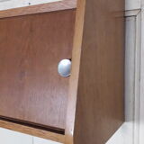 Wall shelf with sliding doors