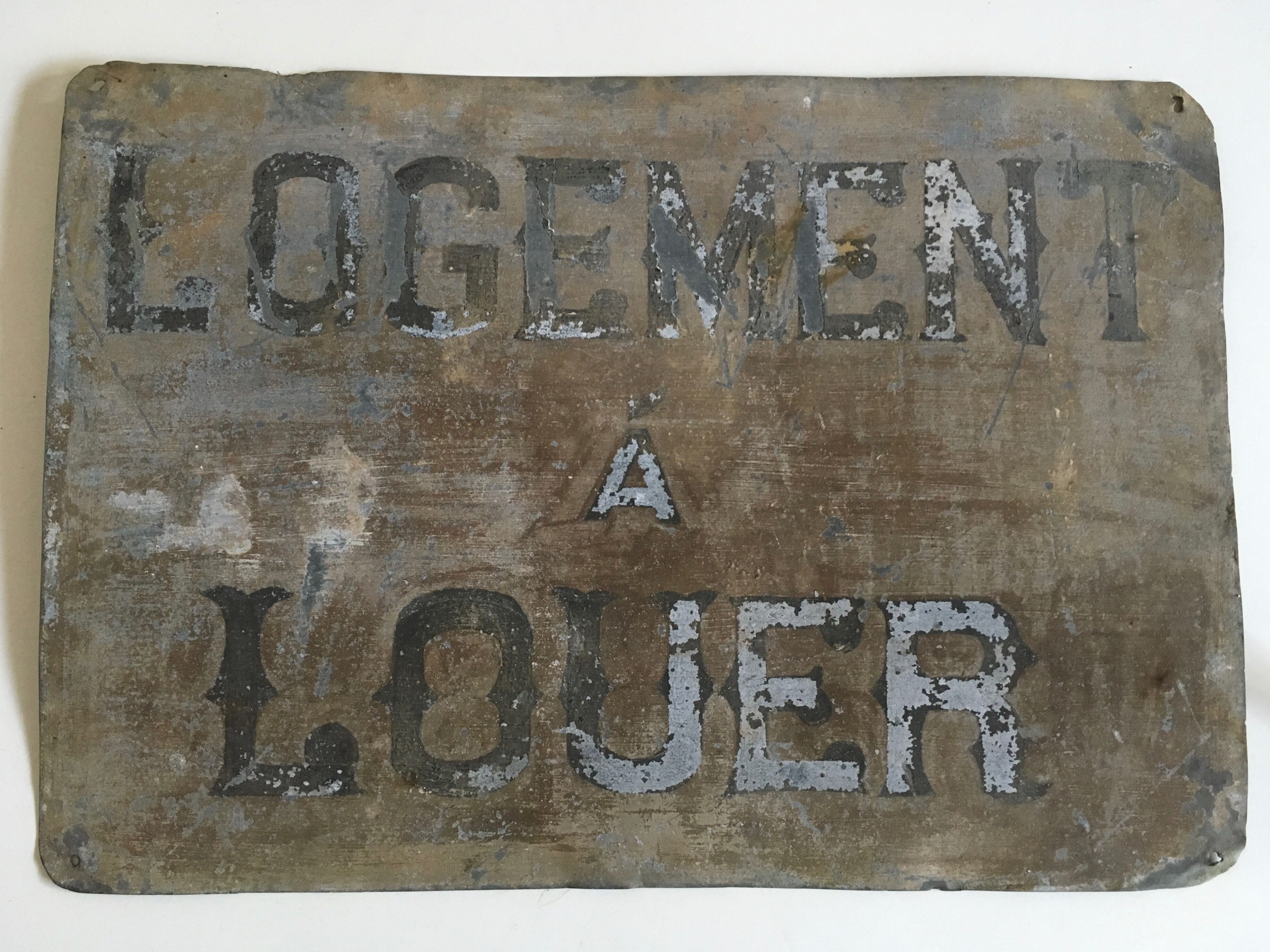 Plaque teaches A Rent in zinc 20s
