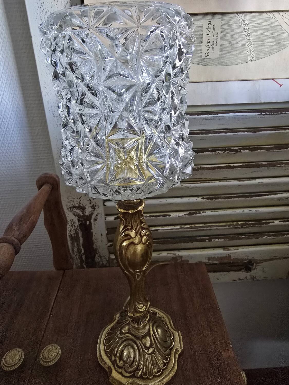 Vintage table lamp with a bronze base and moulded glass globe.