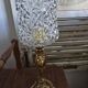 Vintage table lamp with a bronze base and moulded glass globe.