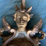Antique scalloped mirror with pediment decorated with cherubs – carved gilded wood
