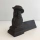 Pair of cast iron andirons in the likeness of a musketeer