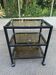 Vintage rolling bar from the 90s, metal and smoked glass.