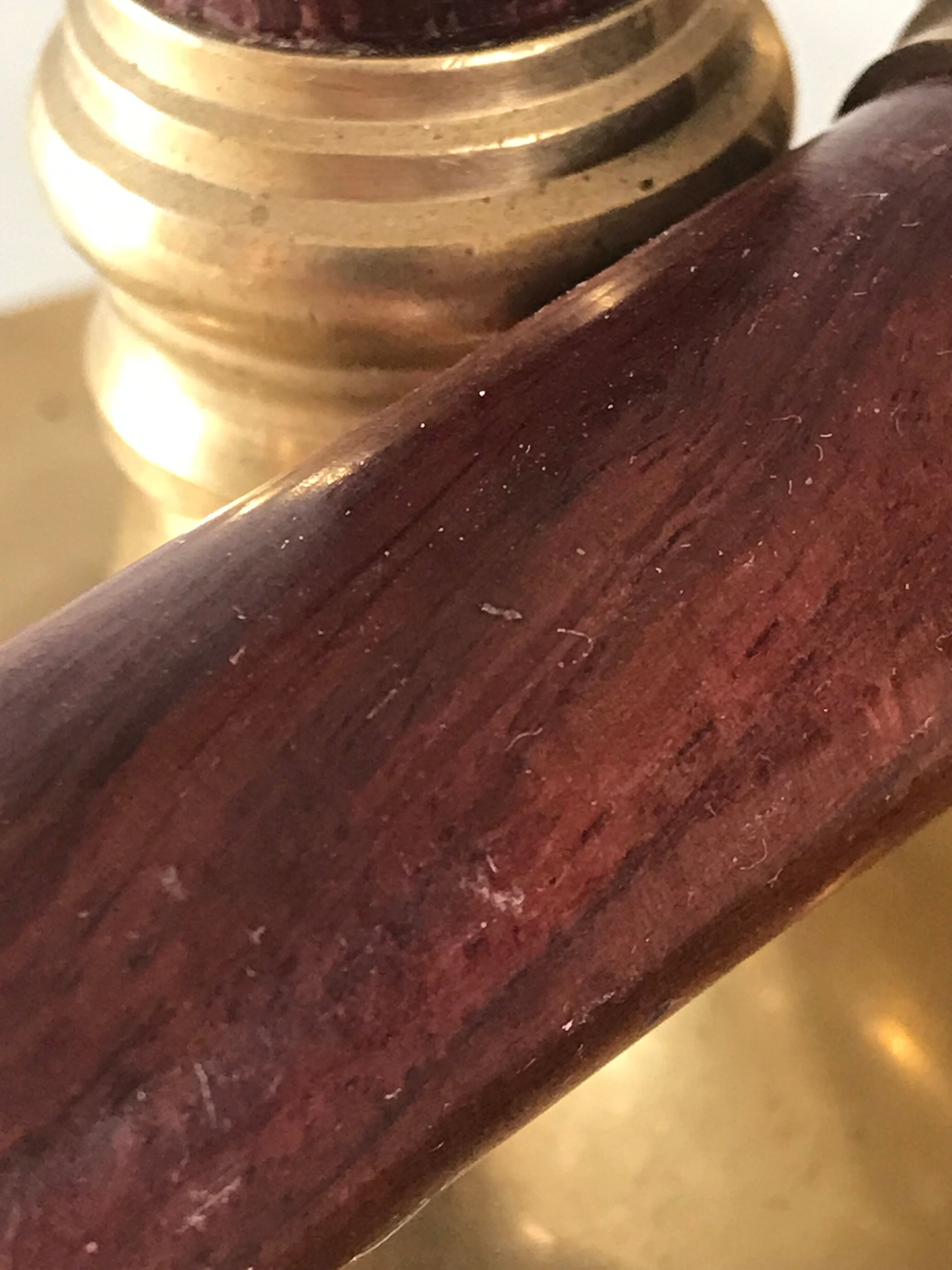 Pair of Scandinavian brass and teak candle holders