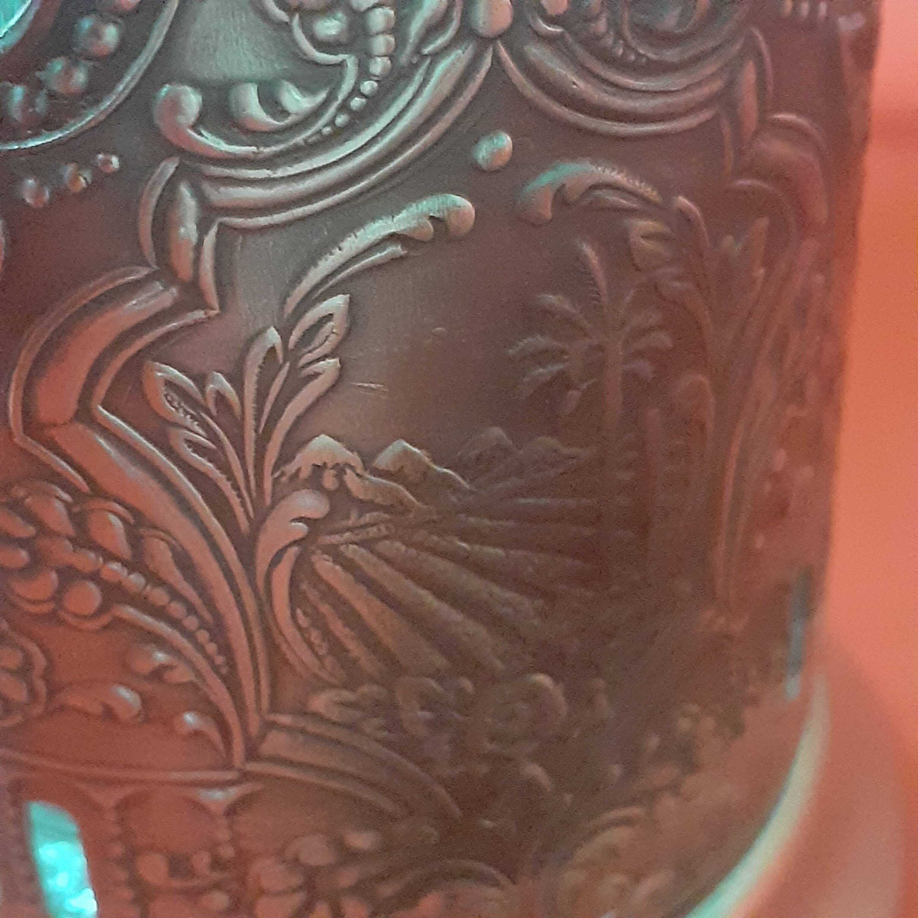 4 glasses engraved on their silver metal support;