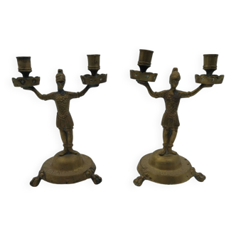 pair of bronze soldier candlesticks