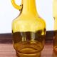 Set of two vintage amber glass carafes attributed to Lubiana.