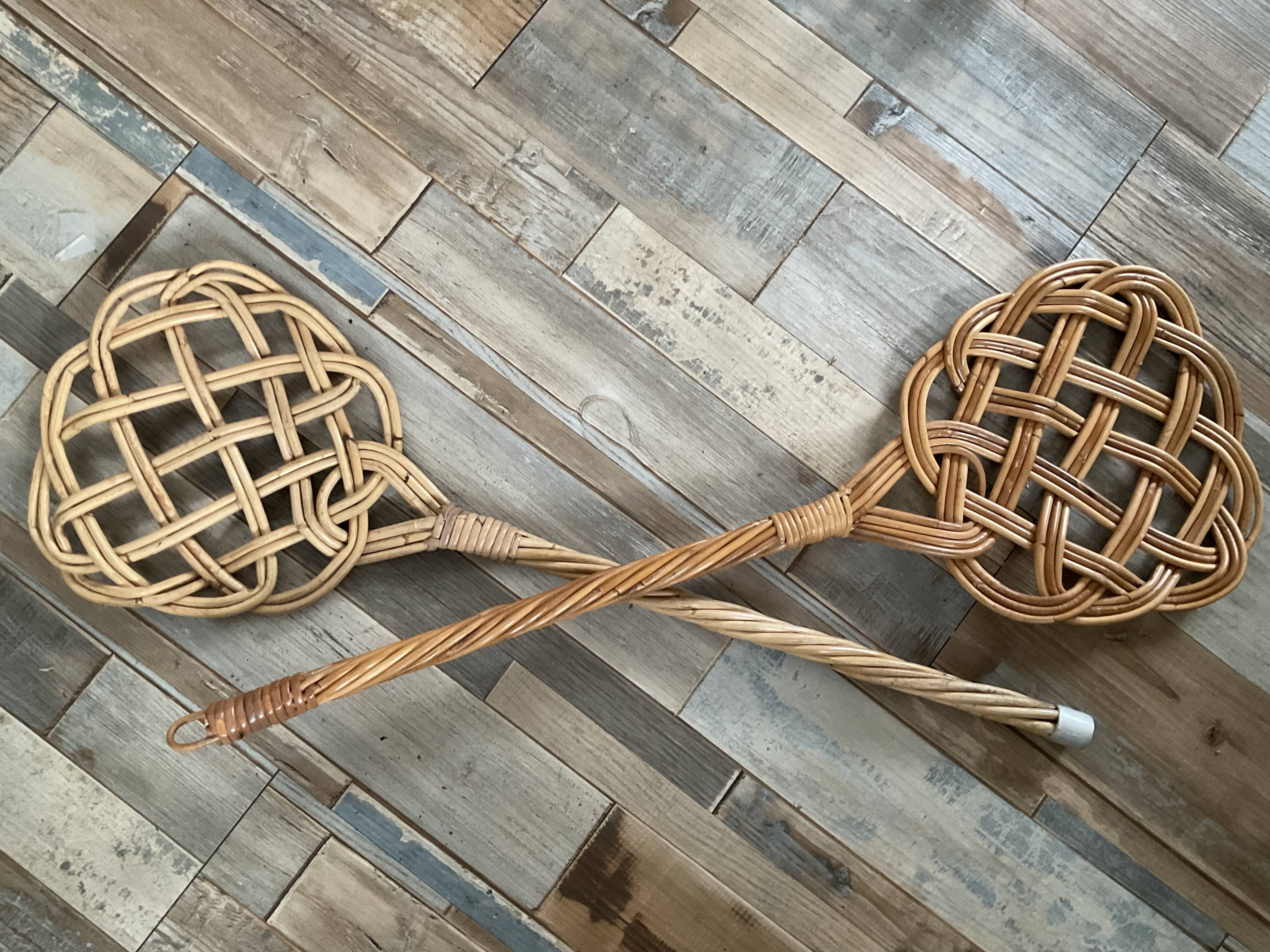 Duo of vintage rattan carpet beaters from the 70s