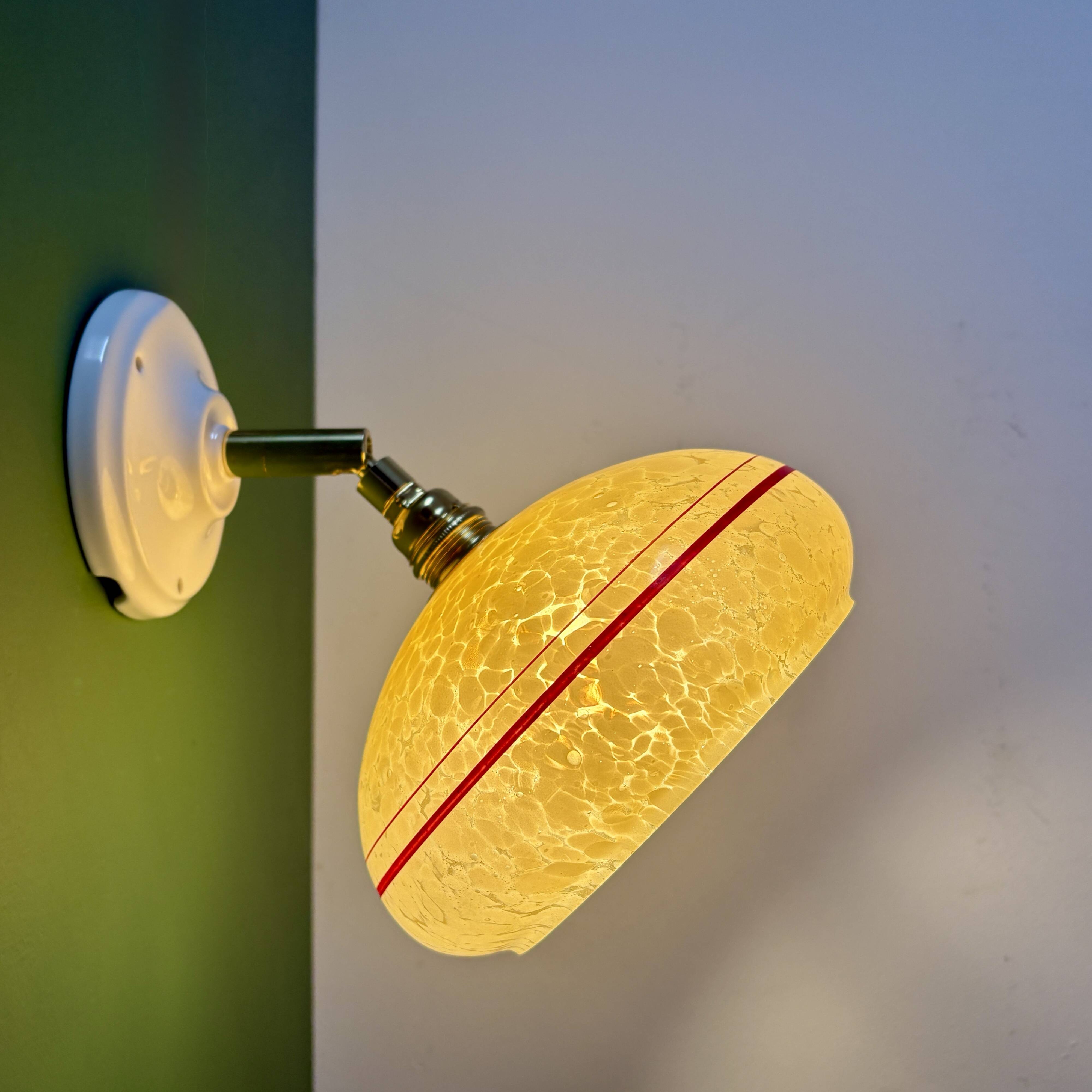 Vintage wall lamp with yellow clichy glass shade and red trim