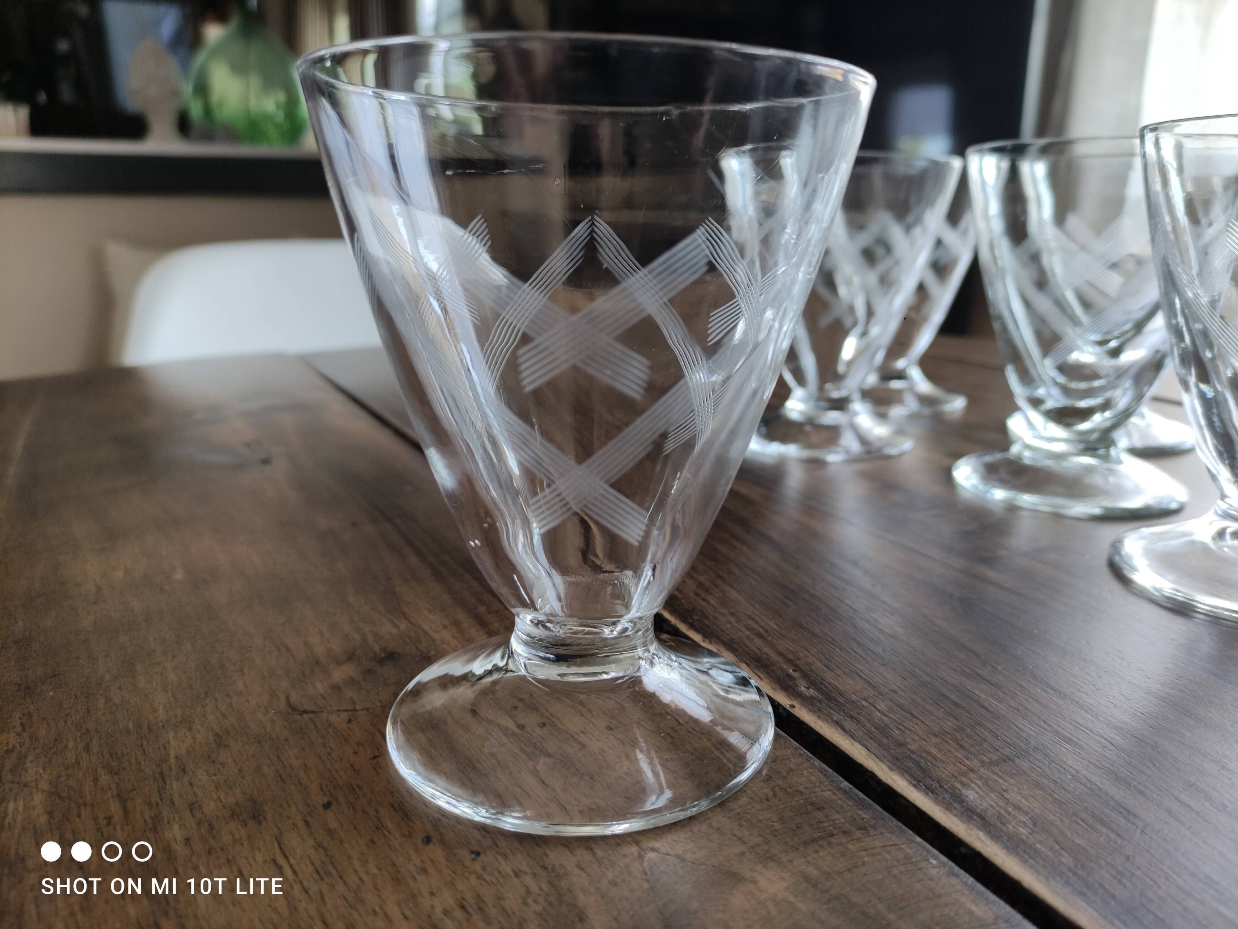 Set of 9 conical glasses on pedestal in antique chiseled glass crosses