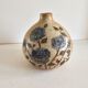 Ceramic lamp base with floral pattern, signed.