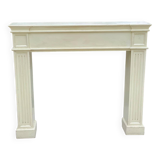 Fireplace surround with beige solid wood mantel