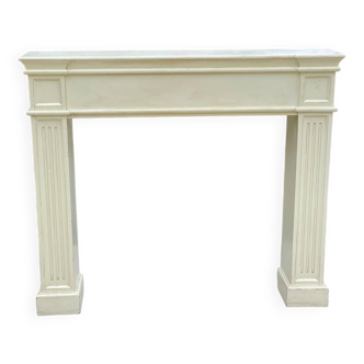 Fireplace surround with beige solid wood mantel