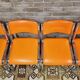 Set de 4 chaises chromées skaï orange 1970 vintage