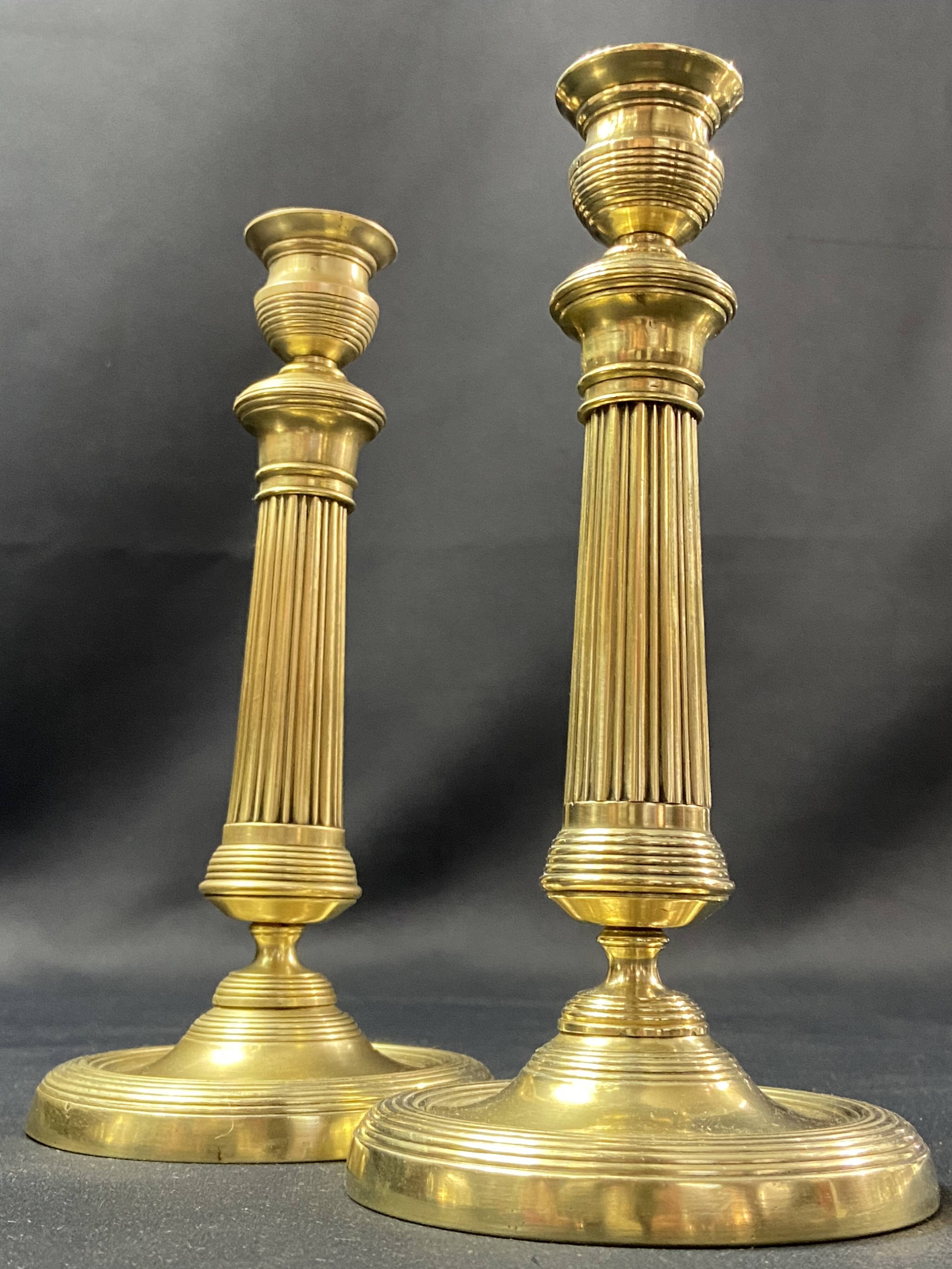 Pair of 19th century gilt bronze candlesticks with fluted shafts, Restoration