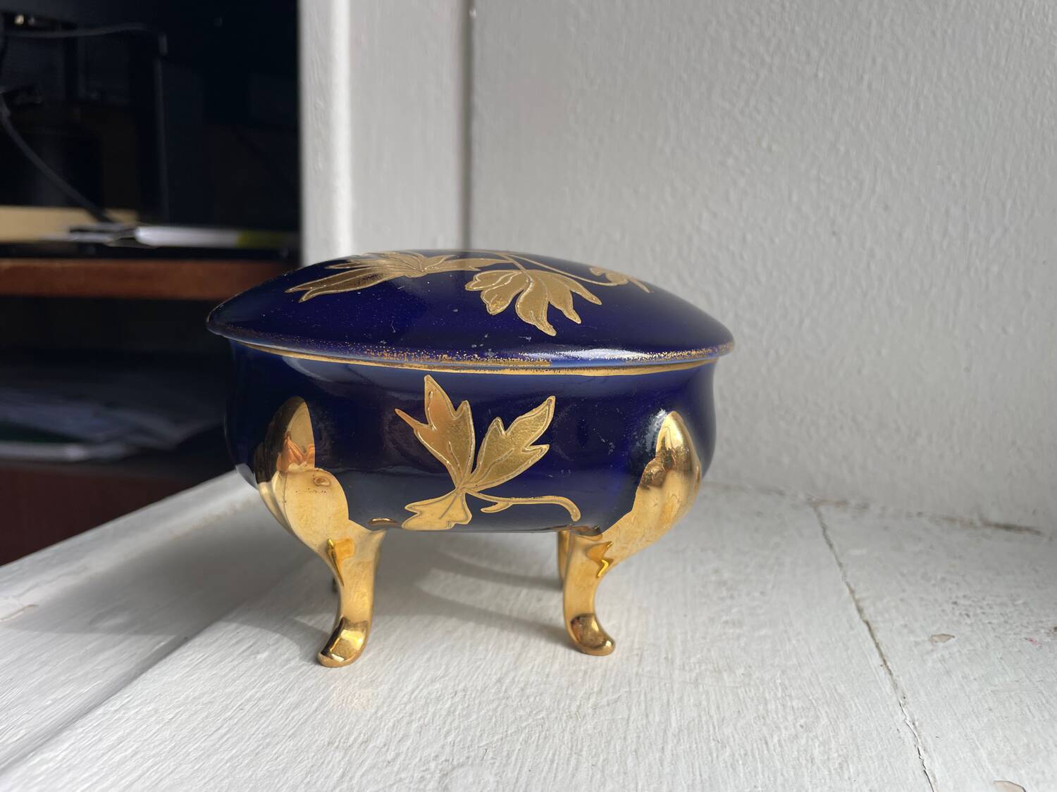 Cobalt blue and gold porcelain bonbonnière, signed JLMenau.
