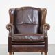 Wing chair made of sheepskin and neatly finished with black piping