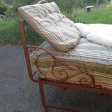 Old wrought iron folding bed