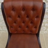 Chic Vintage Chesterfield style chair with wooden frame and faux leather