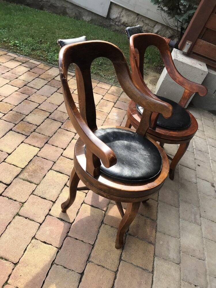 Pair of antique brown swivel armchairs in upholstery fabric, wooden frame, Hungary circa 1900.