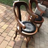 Pair of antique brown swivel armchairs in upholstery fabric, wooden frame, Hungary circa 1900.