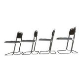 Four vintage chairs from the 1960s and 1970s, chrome with faux leather.