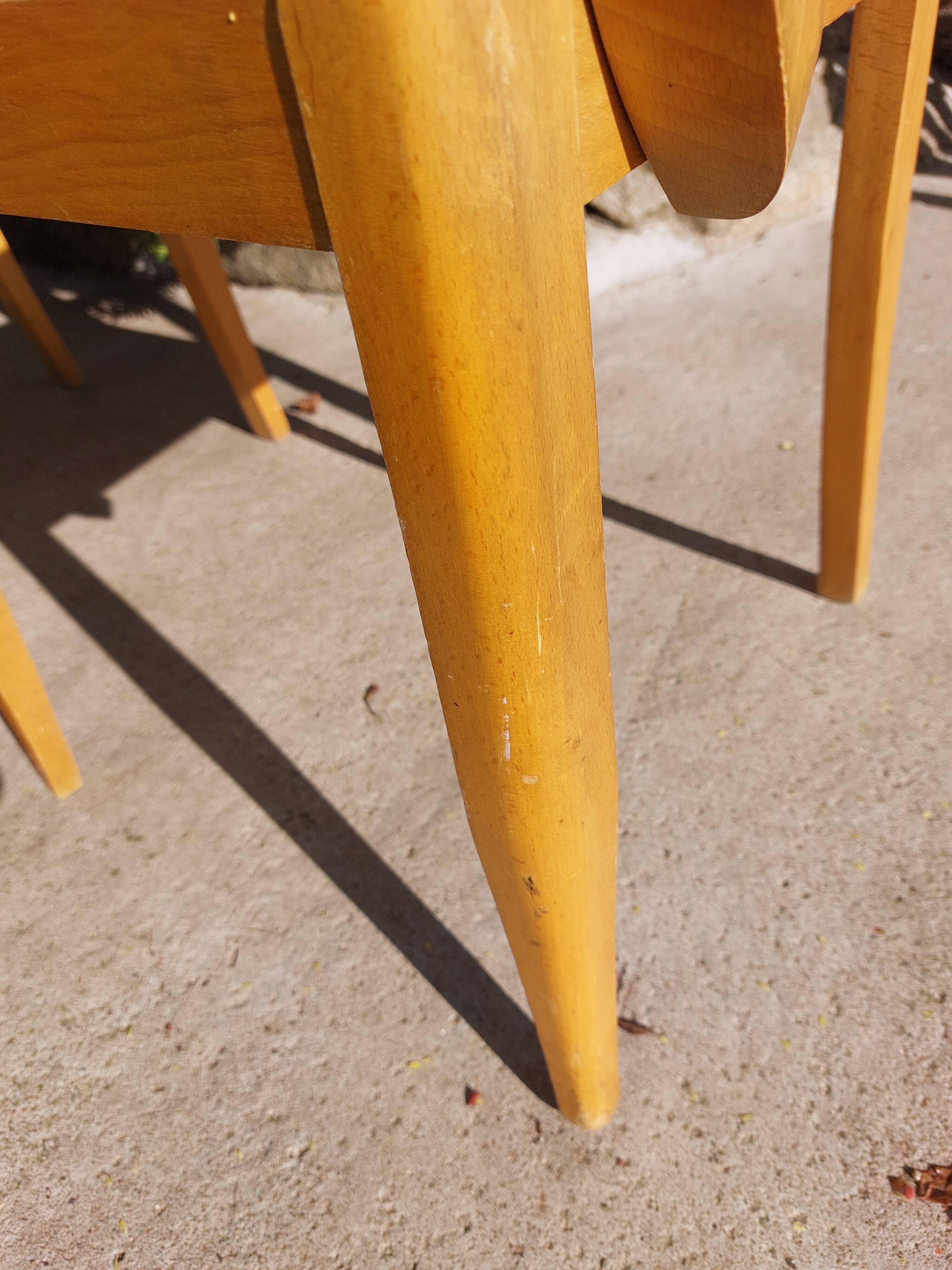 3 vintage bridge chairs with rounded armrests.