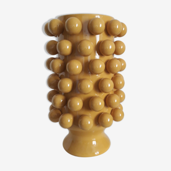 Yellow vase with balls