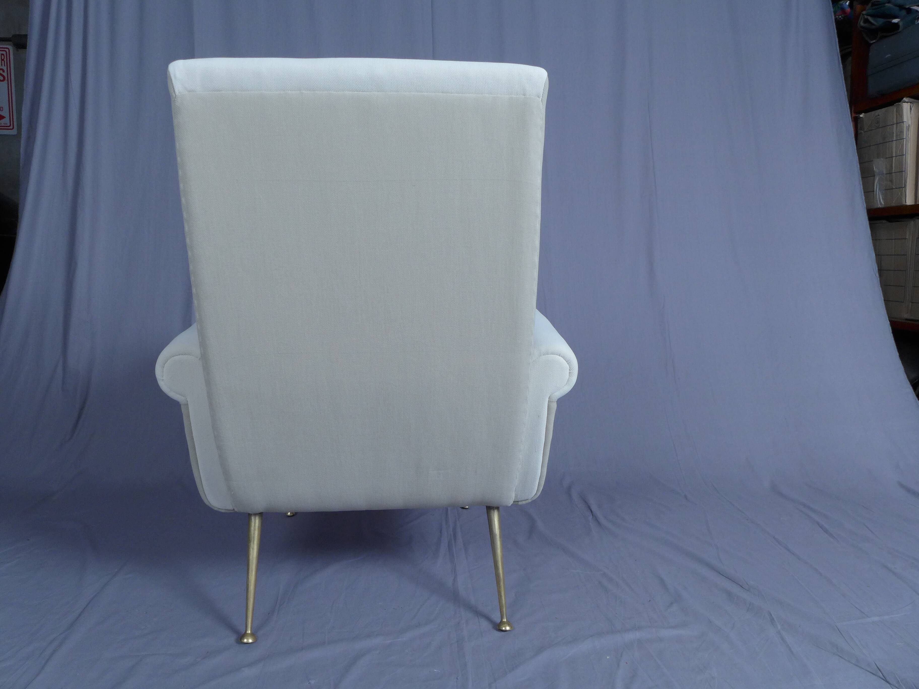 Pair of low armchairs in brass and textile. Italy 1950s