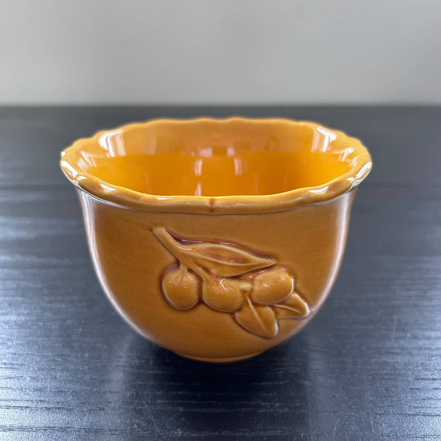 Scalloped bowl with olive decoration