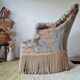 Fauteuil crapaud ancien velours fleuri avec franges