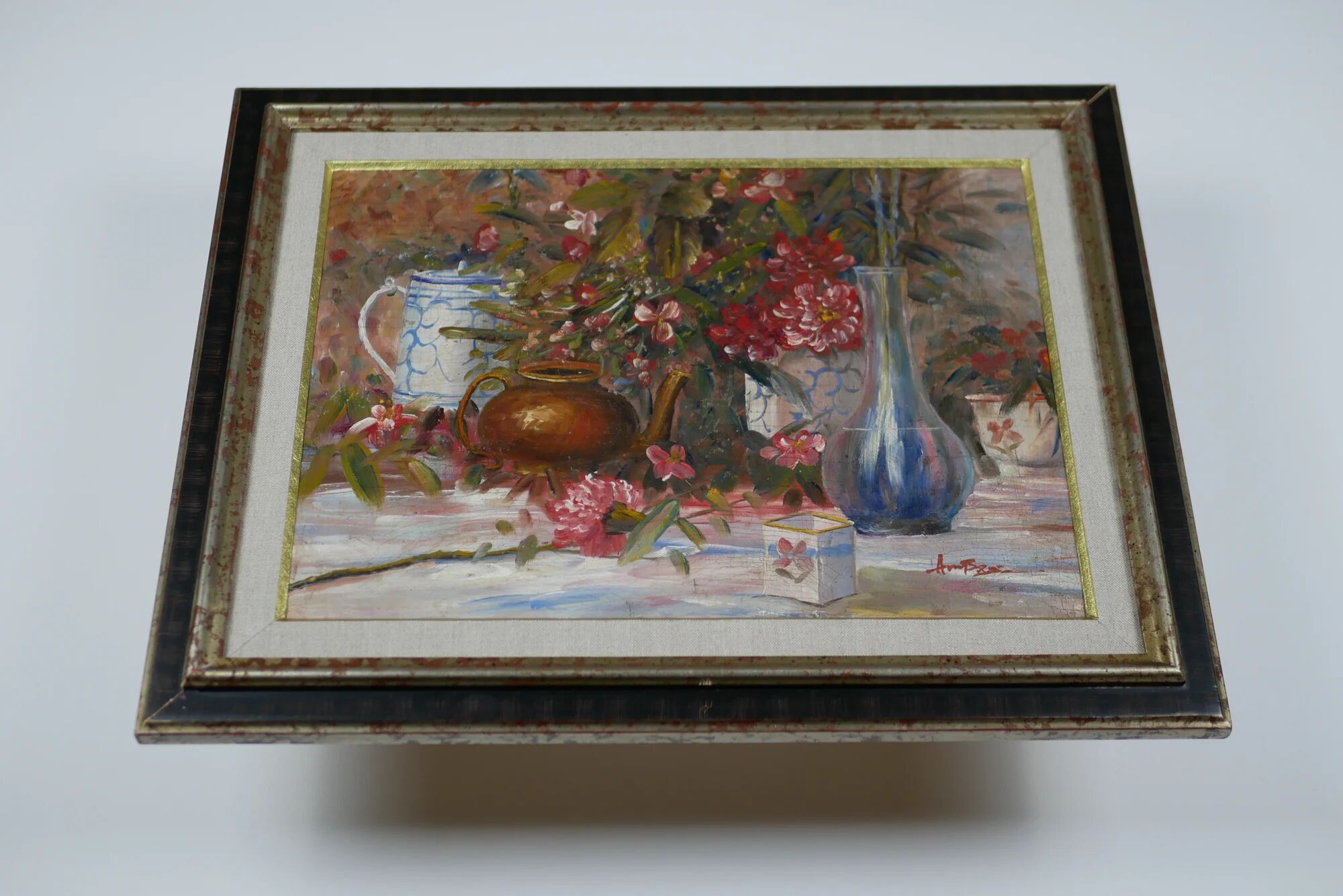 Still life with pink flowers and blue pots.