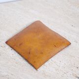 Empty pocket in psychedelic enamelled leather
