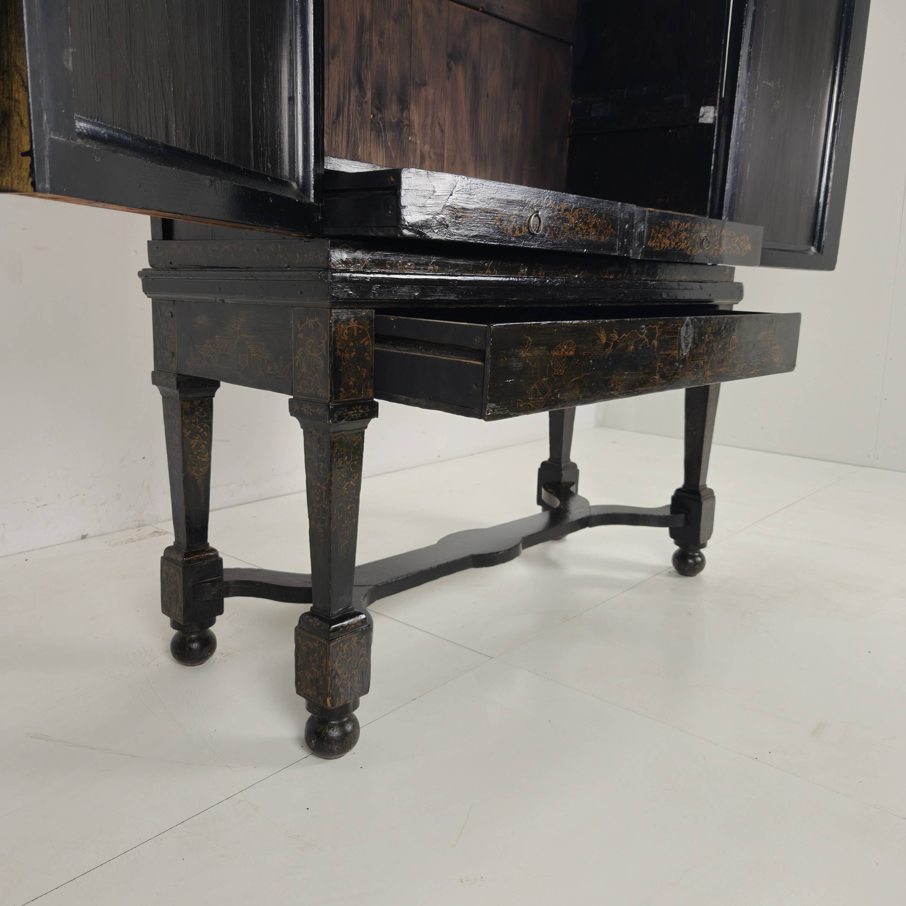 A rare early 18th-century Dutch japanned chinoiserie cabinet, circa 1700
