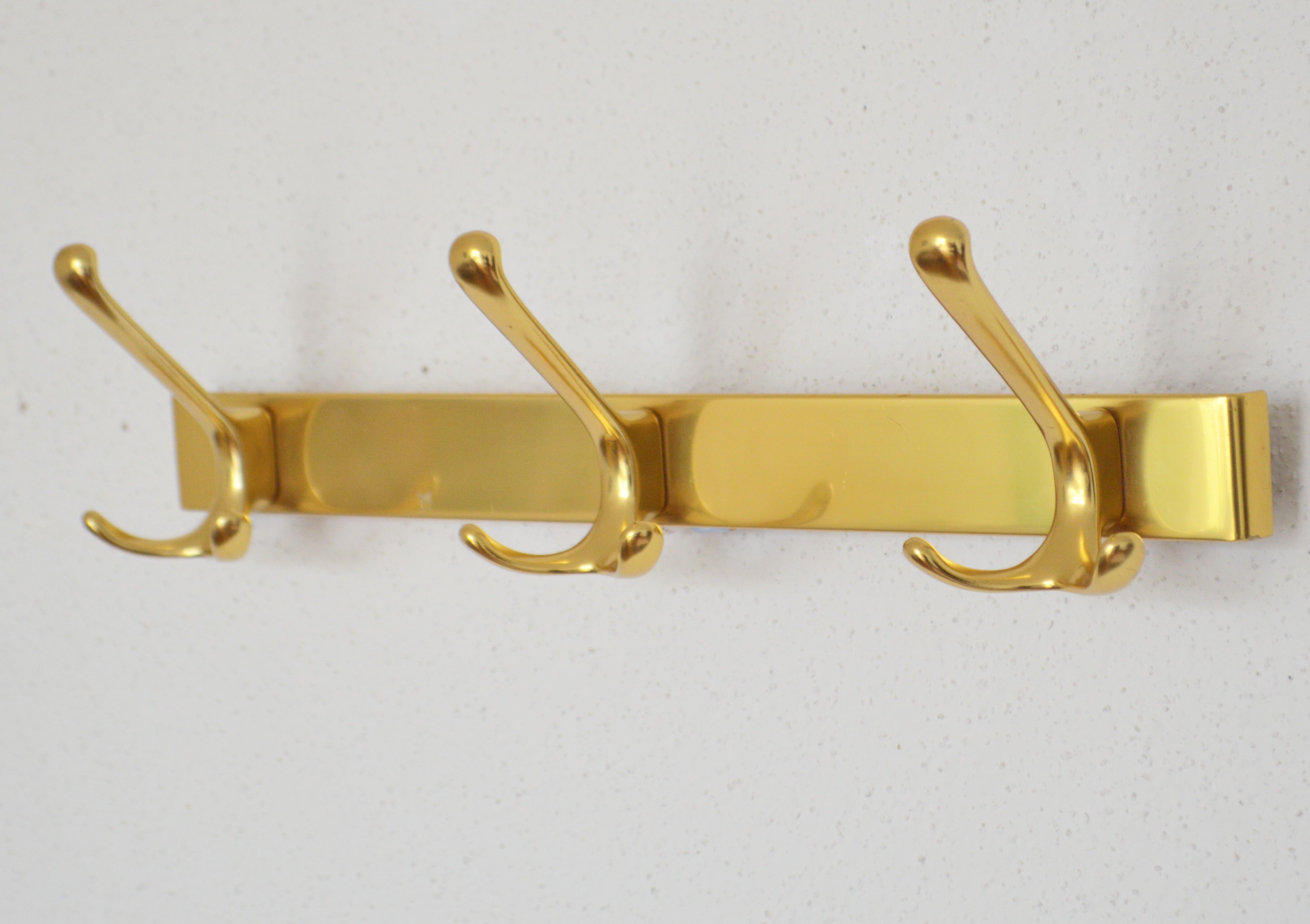Brass wall-mounted coat rack in Bauhaus style from the 1950s