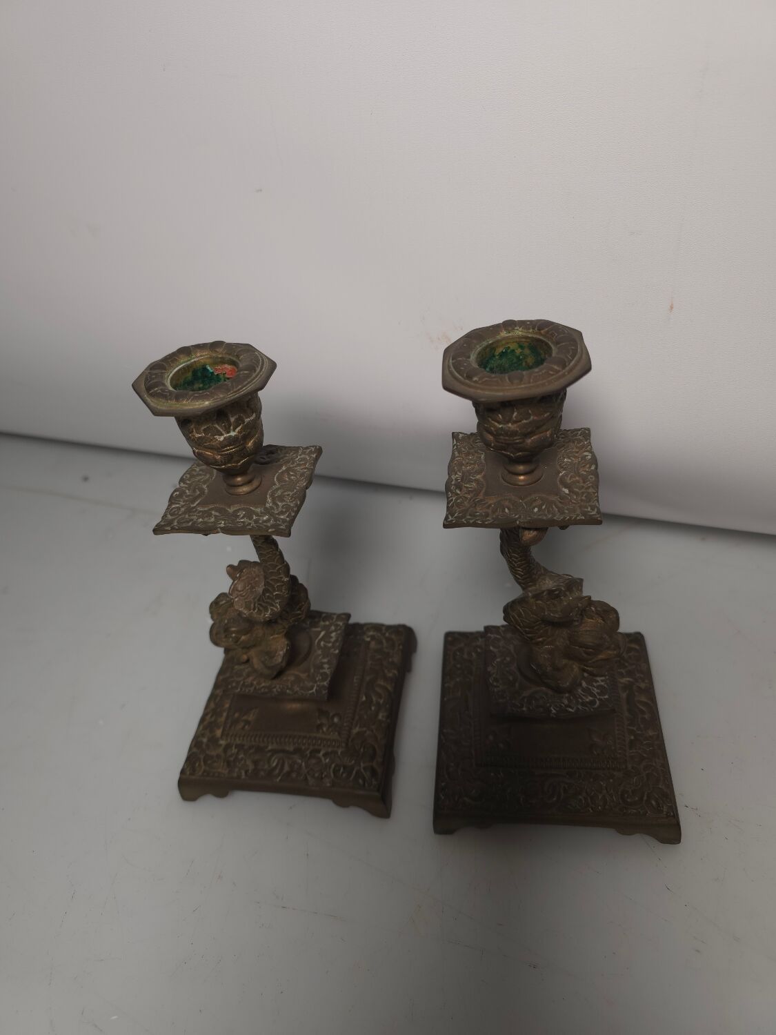 Pair of candlesticks with bronze dolphins