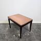 Vintage wooden ottoman from the 1940s with a silk top and studded trim.