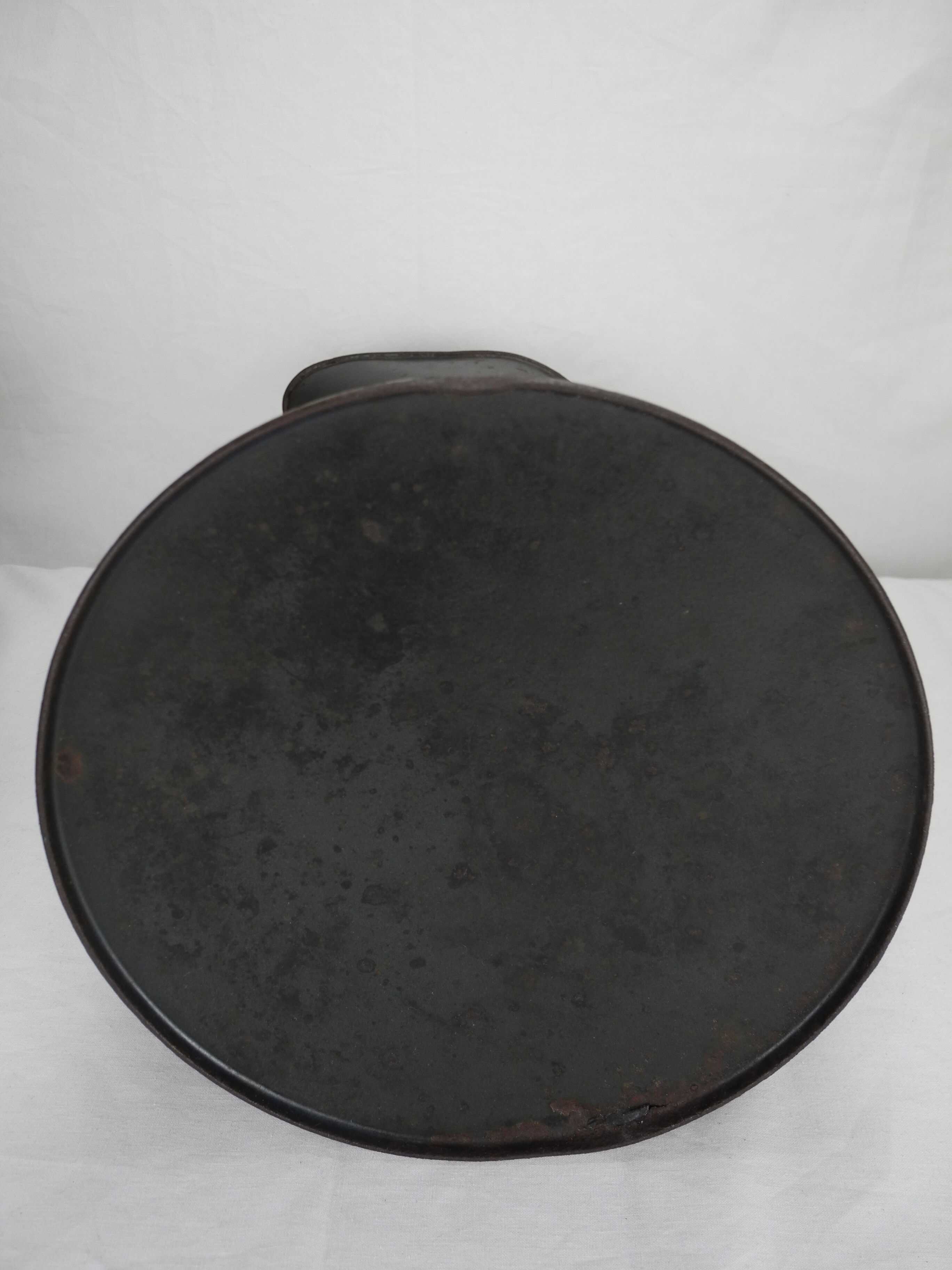 Old enamelled sheet metal jug