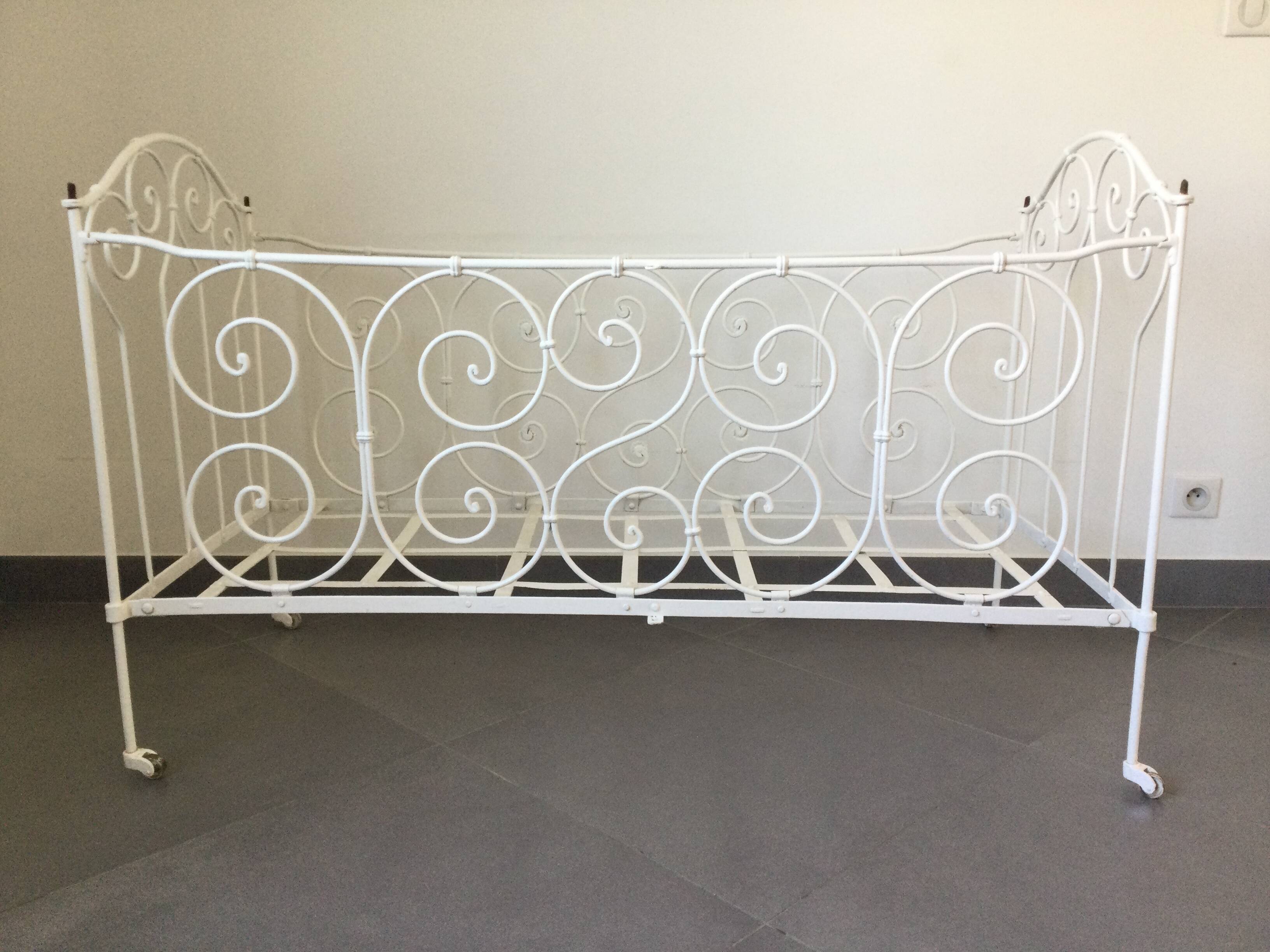 White wrought iron folding bed