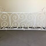 White wrought iron folding bed