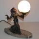 Art deco lamp in regul and marble "woman holding a globe"