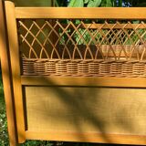 Vintage wooden and rattan baby cot from the 1960s.