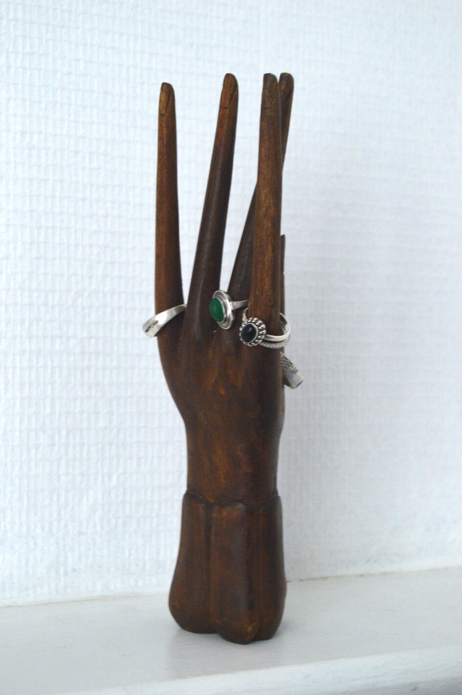 Carved wooden baguier hand