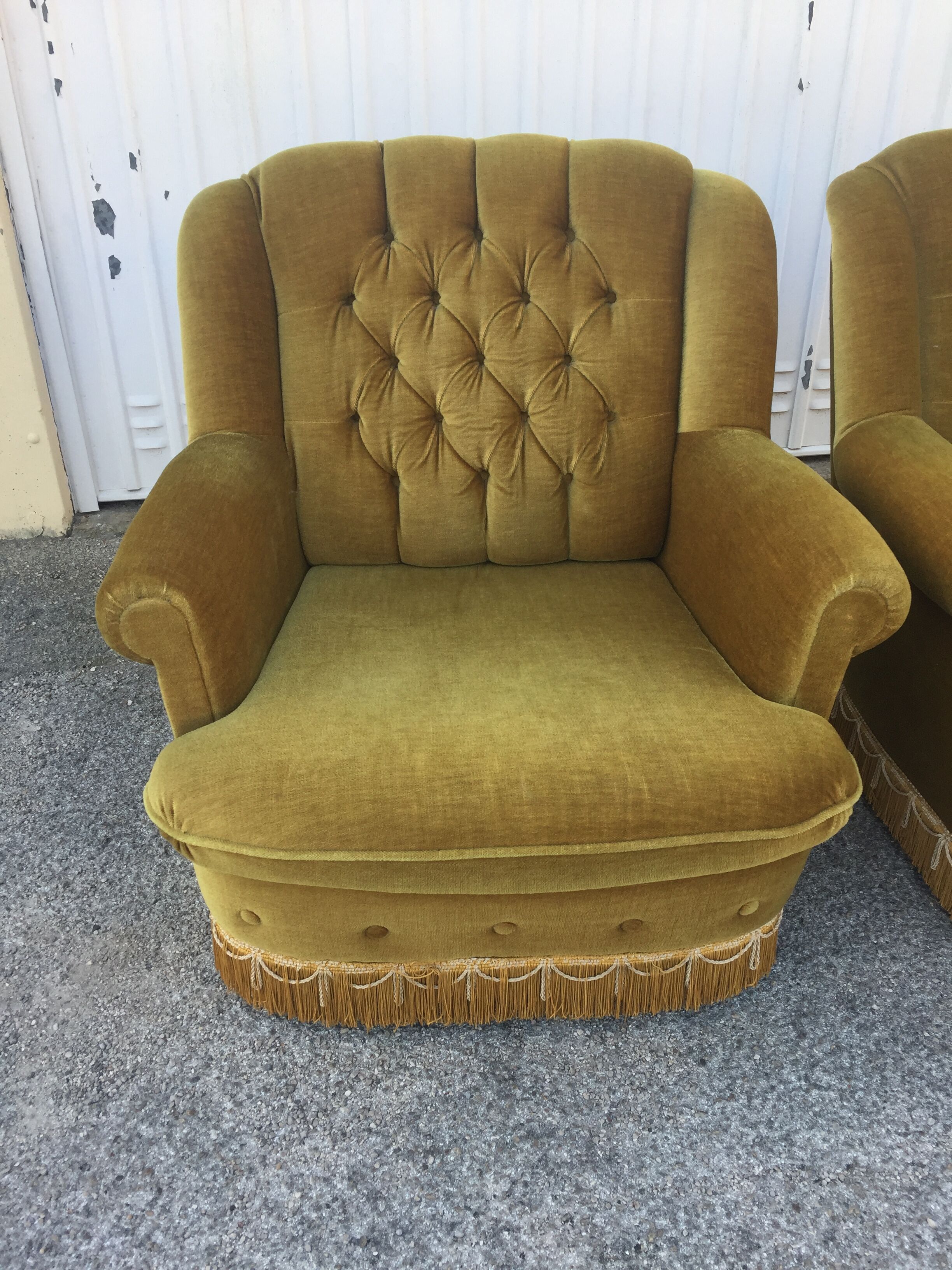 Pair of upholstered velvet armchairs