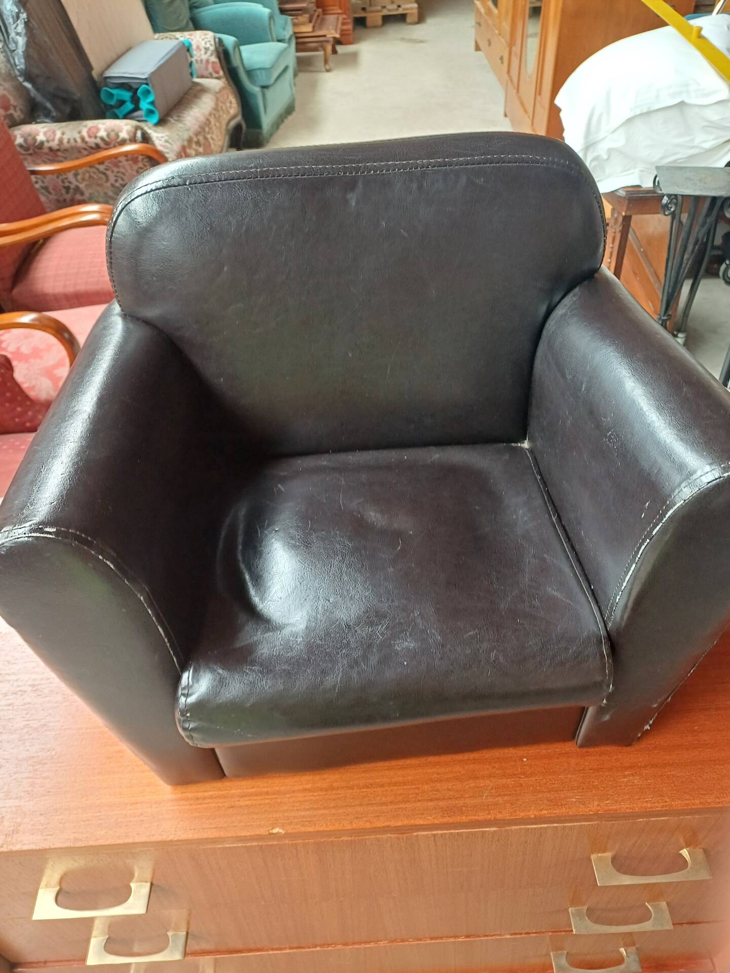 Mini black leather armchair for children