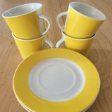 4 yellow and white cups and saucers