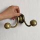 Antique double coat hook in solid brass